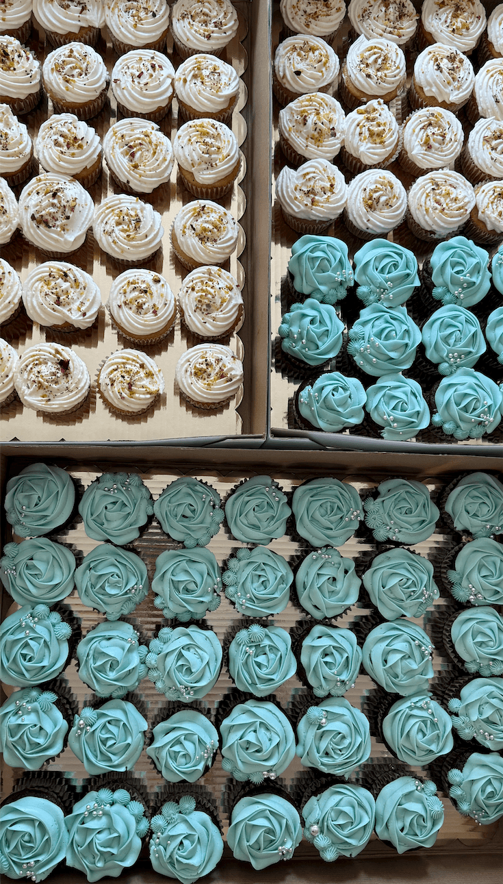 Elegant blue and white eggless cupcakes with floral decoration, made by Cakes by Ashni in New Jersey