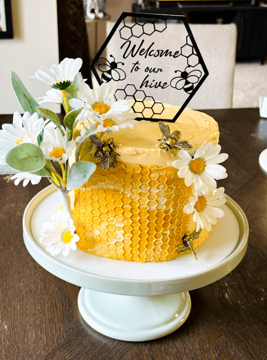 Honey bee themed housewarming cake with golden bee decorations, handcrafted by Cakes by Ashni for a new home celebration in NJ